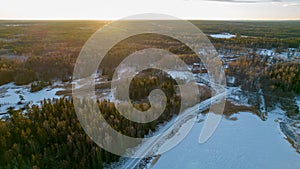 Aerial view of little Swedish village with islands and forests on a Baltic sea coast at winter time. Drone photography - winter in