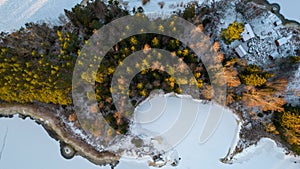 Aerial view of little Swedish village with islands and forests on a Baltic sea coast at winter time. Drone photography - winter in