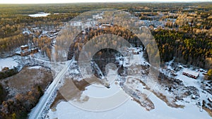 Aerial view of little Swedish village with islands and forests on a Baltic sea coast at winter time. Drone photography - winter in