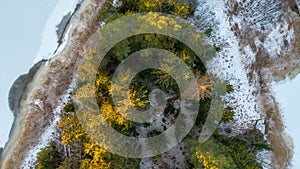 Aerial view of little Swedish village with islands and forests on a Baltic sea coast at winter time. Drone photography - winter in