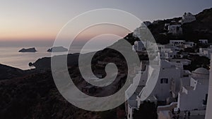 Aerial view of Little Village on Milos Island, Greece after Sunset with Ocean View