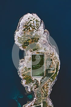 Aerial view Lofoten islands Henningsvaer village football field and sea landscape in Norway