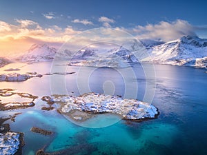 Aerial view of Lofoten islands in winter at sunset in Norway