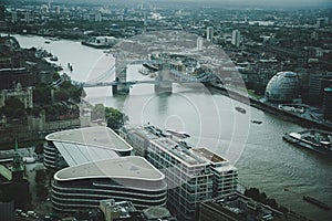 Aerial view of London: from the Tower Bridge to the financial district Canary Wharf during evening time