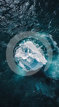 Aerial view of a lone iceberg in the ocean