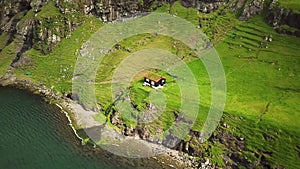 Aerial view of a lonely house in Saksun village, Faroe Islands. Faroese nature.