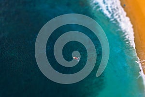 Aerial view of the longboard surfer