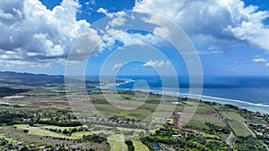 Aerial View of Lush Green Field Next to Ocean