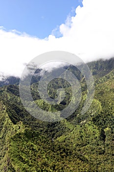 An aerial view of the lush and verdant mountainsides and valleys in Waimea Canyon State Park