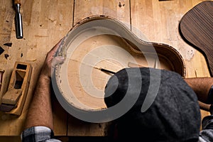 Table of a luthier. Making spruce top of a Spanish guitar photo