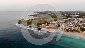 Aerial view of luxury golf course next the cliff, ocean and beach in Bali island, Indonesia.