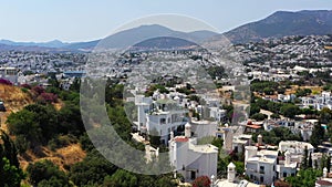Aerial view of luxury houses of Bodrum, Turkey. White buildings and streets of mediterranean riviera town