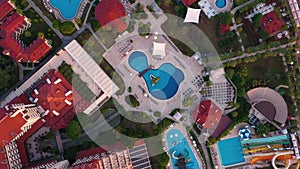 Aerial view of luxury resort hotel with swimming pool.