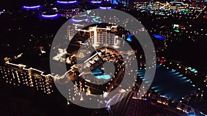 Aerial view on luxury resort hotel territory at night. Video. Night view of illuminated inner territory of hotel complex