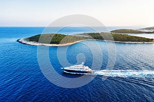 Aerial view on the luxury yacht at the day time. Adventure and travel. Landscape with ship on Adriatic sea. Luxury cruise.