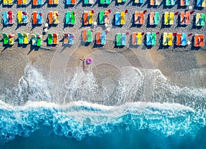 Aerial view of lying woman with swim ring in the sea