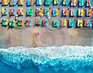 Aerial view of lying woman with swim ring in the sea