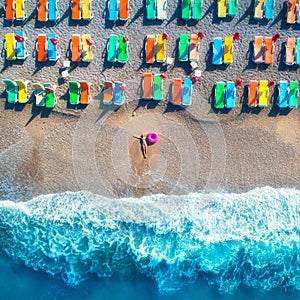 Aerial view of lying woman with swim ring in the sea