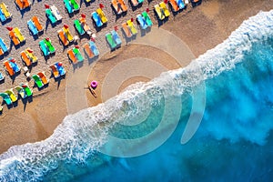 Aerial view of lying woman with swim ring in the sea in Oludeniz, Turkey. Summer scene