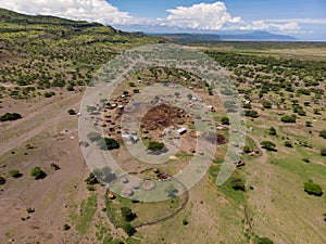 Aerial view of Maasai boma or family rural village on the coast of Salty lake Natron in the Great Rift Valley, Tanzania