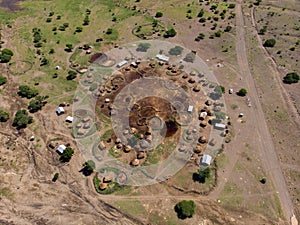 Aerial view of Maasai boma or family rural village on the coast of Salty lake Natron in the Great Rift Valley, Tanzania