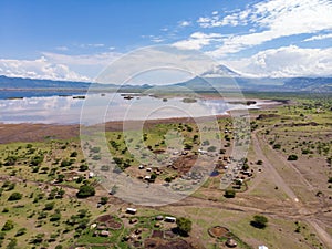 Aerial view of Maasai boma or family rural village on the coast of Salty lake Natron in the Great Rift Valley, Tanzania