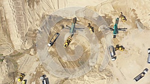 Aerial view, machinery working at clay quarry, heavy loaders, large trucks, bulldozers, excavators, Sand quarry, Mining, Truck