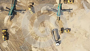 Aerial view, machinery working at clay quarry, heavy loaders, large trucks, bulldozers, excavators, Sand quarry, Mining, Truck