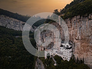 Aerial view of Madonna della Corona Sanctuary at sunset