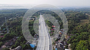 Aerial view of Mae Khaem intersection traffic road in Phrae, Thailand. The road outside the city