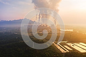 Aerial view of Mae Moh Coal Power Plant with smoke and toxic air from chimney. Factory industry. Electricity tower in energy or