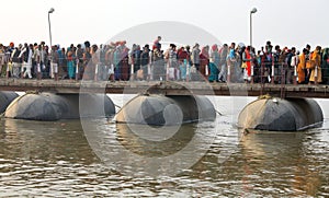 Thousands of Hindu devotees crossing the pontoon bridges over the Ganges River at Maha Kumbh Mela festival