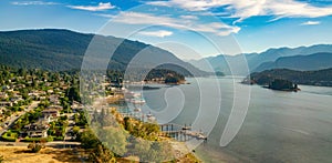 Aerial view of the majestic mountains and serene waters under a blue sky. Deep Cove, BC, Canada