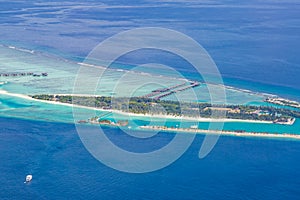 Aerial view of Maldives beach landscape. Maldives island view from seaplane or drone