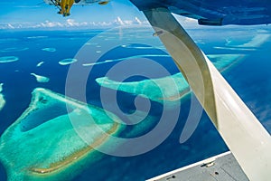 Aerial view of Maldives beach landscape. Maldives island view from seaplane or drone