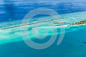 Aerial view on Maldives island, Ari atoll. Tropical islands and atolls in Maldives from aerial view. Summer vacation holiday