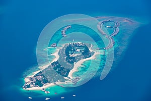 Aerial view on Maldives island, Ari atoll. Tropical islands and atolls in Maldives from aerial view. Summer vacation holiday