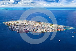 Aerial view on male the capital city of maldives. overcrowded island in the indian ocean  blue ocean sea background