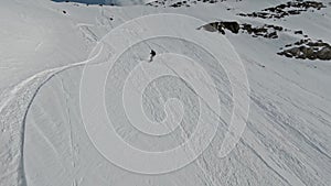 Aerial view man freeride snowboard from high mountain summit extreme sport lifestyle winter activity