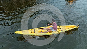 Aerial view of a man sailing a boat near the Wag Hill lodge and spa on the shore of Lake Victoria