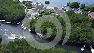 Aerial view of the mangrove forest on Junggut Batu, Nusa Lembongan. There are several fisherman`s houses around there. White sand
