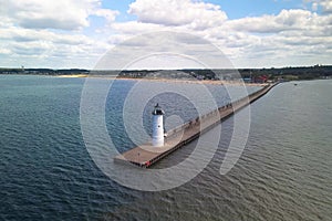 Manistee light house at lake Michigan shore line