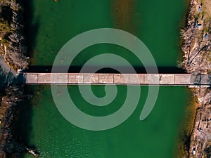 Aerial view of Mansfield Dam with crystal-clear blue water on a sunny day