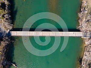 Aerial view of Mansfield Dam with crystal-clear blue water on a sunny day