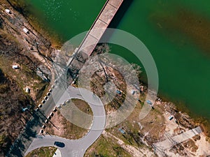 Aerial view of Mansfield Dam with crystal-clear blue water on a sunny day