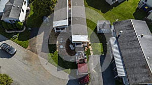 Aerial View of a Manufactured, Mobile, Prefab Double Wide Home Being Installed in a Lot in a Park