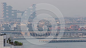 Aerial view of many luxury villas and hotels on the Palm Jumeirah island in Dubai timelapse. UAE