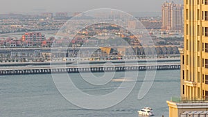 Aerial view of many luxury villas and hotels on the Palm Jumeirah island in Dubai timelapse. UAE