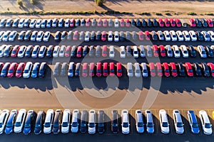 Aerial view of many new cars at a port