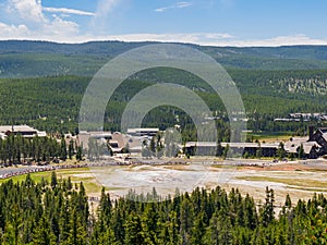 Aerial view of many people waiting for the Old Faithful geyser hot water eruptions